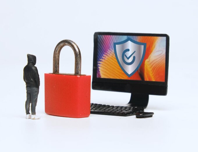 hacker trying to hack the website while a red colour ped lock stoping him concept of Secure & Scalable Websites